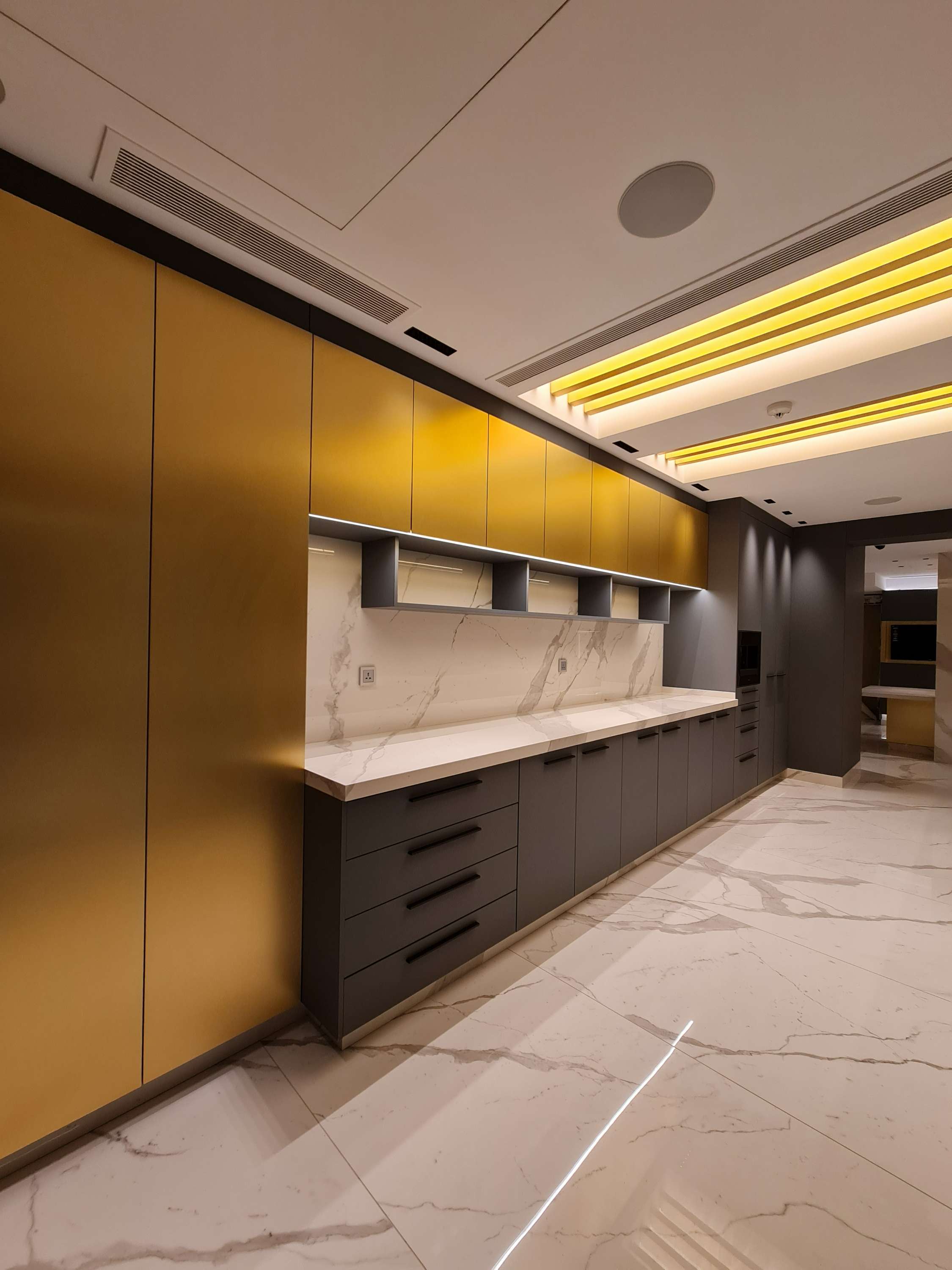Family-friendly kitchen with an inviting dining area and warm lighting by La Fabriqua