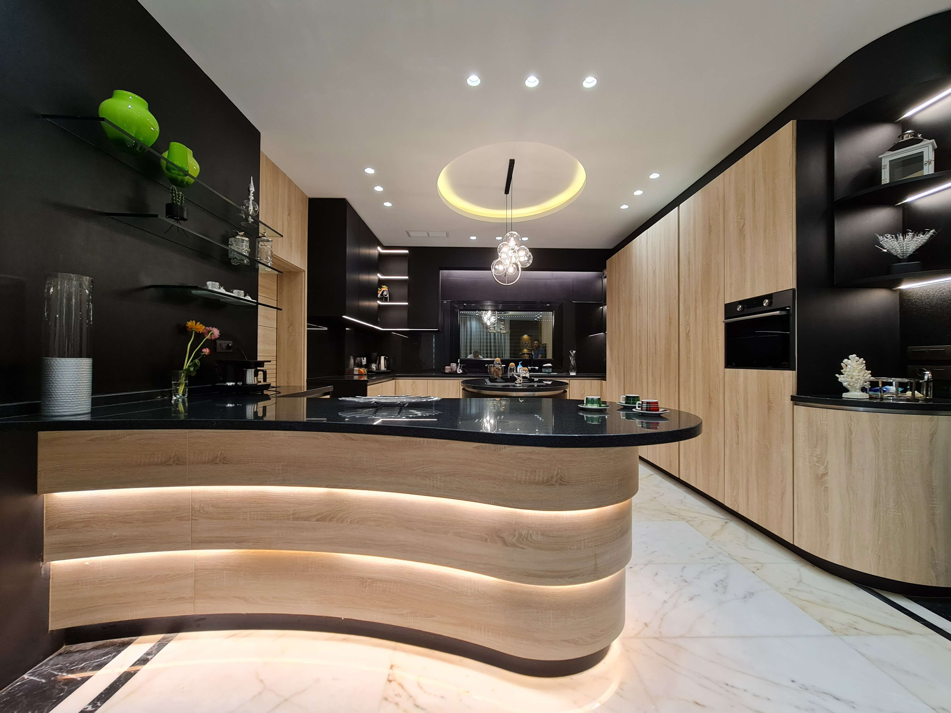 Spacious kitchen with premium appliances and an open layout by La Fabriqua