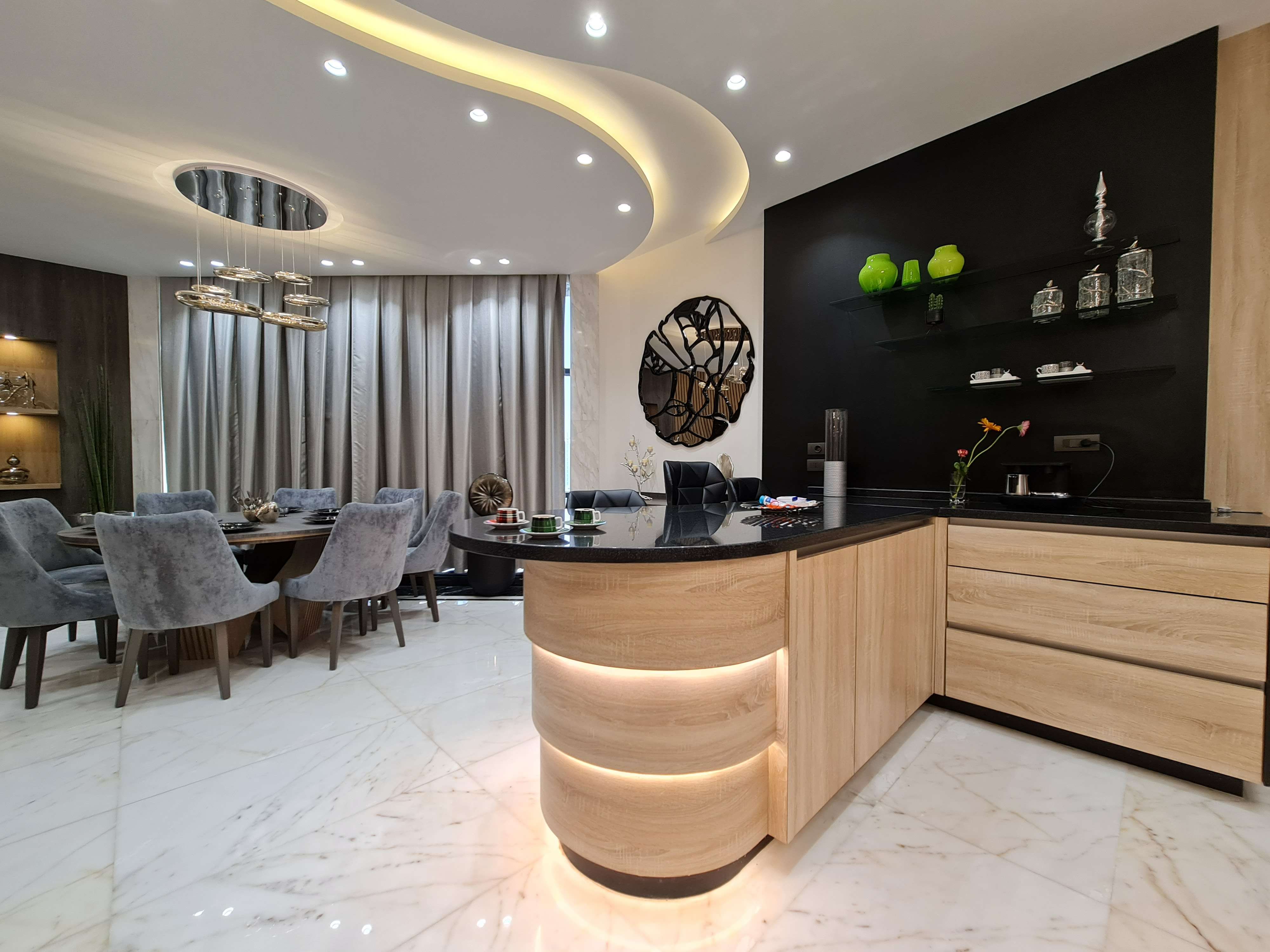 Luxury kitchen with marble countertops and sophisticated lighting design by La Fabriqua